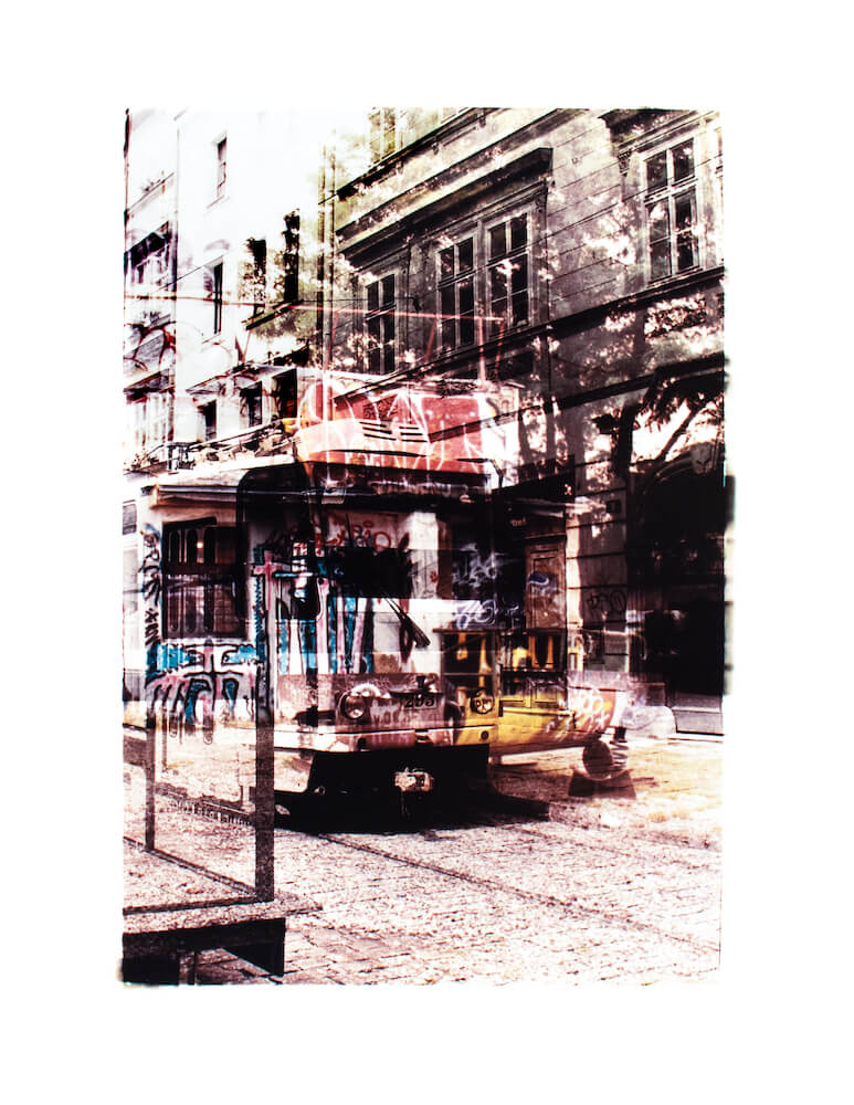 a color film fine art photograph with an image of a tram in Pilsen Czech Republic layered with an image of Bike Jesus in Prague