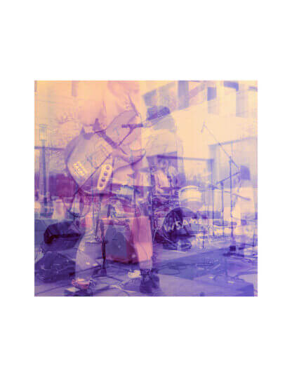 color darkroom medium format fine art film photograph of a below the neck view of a musician playing a guitar layered with images of a drummer and a bass player at a concert